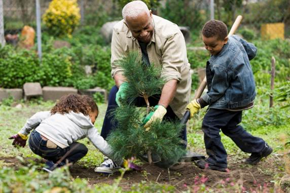 Children helping man in garden