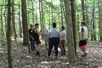 A group of people standing in a forest