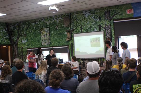 A group of people in a classroom

Description automatically generated